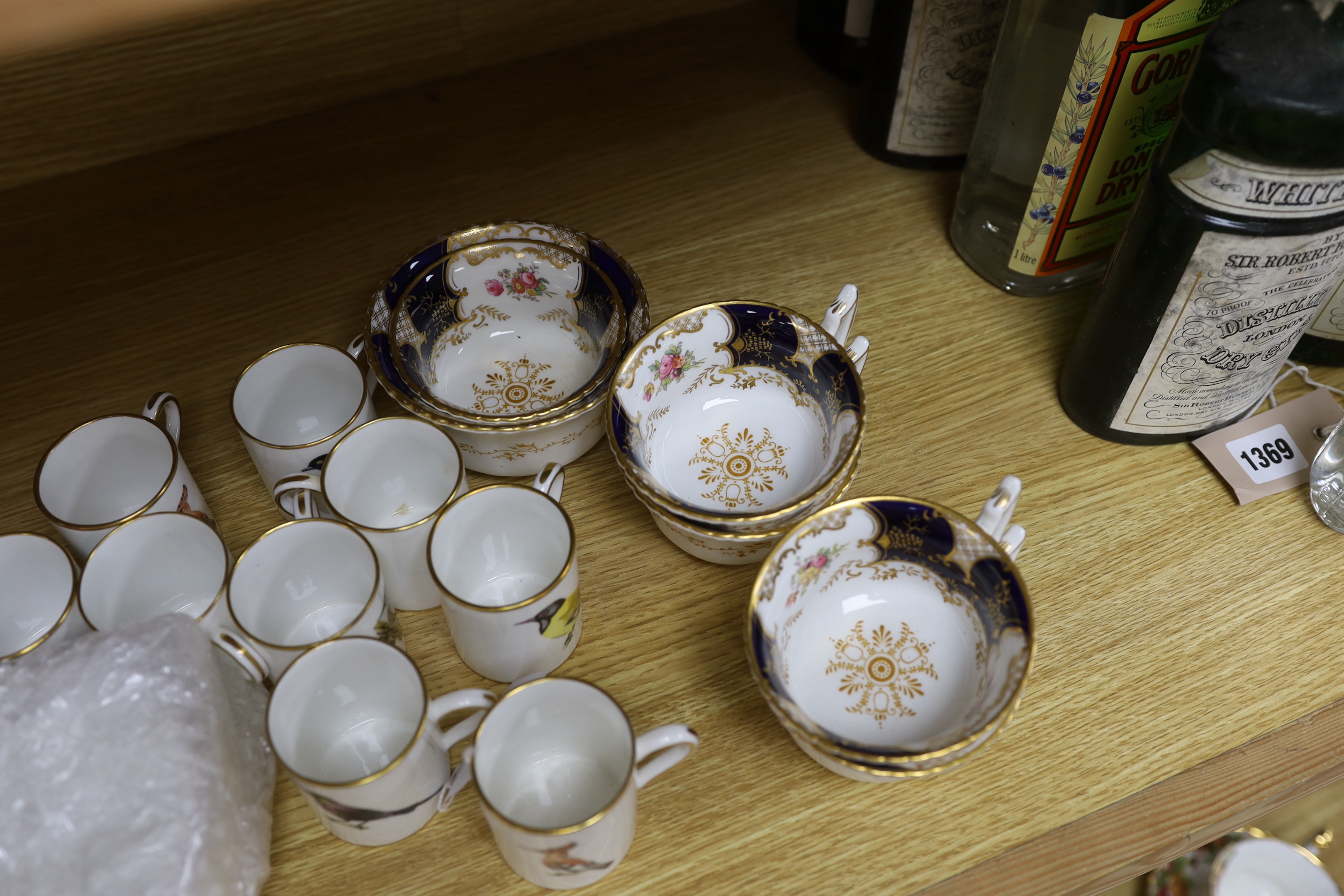 A Worcester bird decorated coffee set for ten and a Coalport tea set